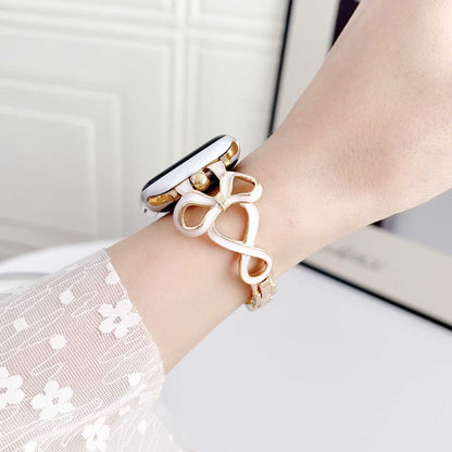 iBandGear Sculpted Bow Gold-White band worn on wrist