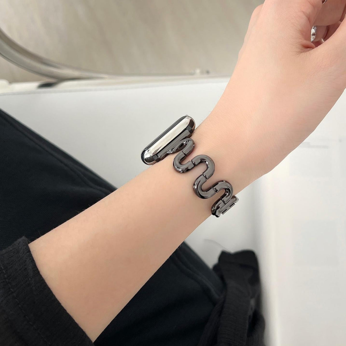 iBandGear Sculpted S-Curve black band worn on the wrist